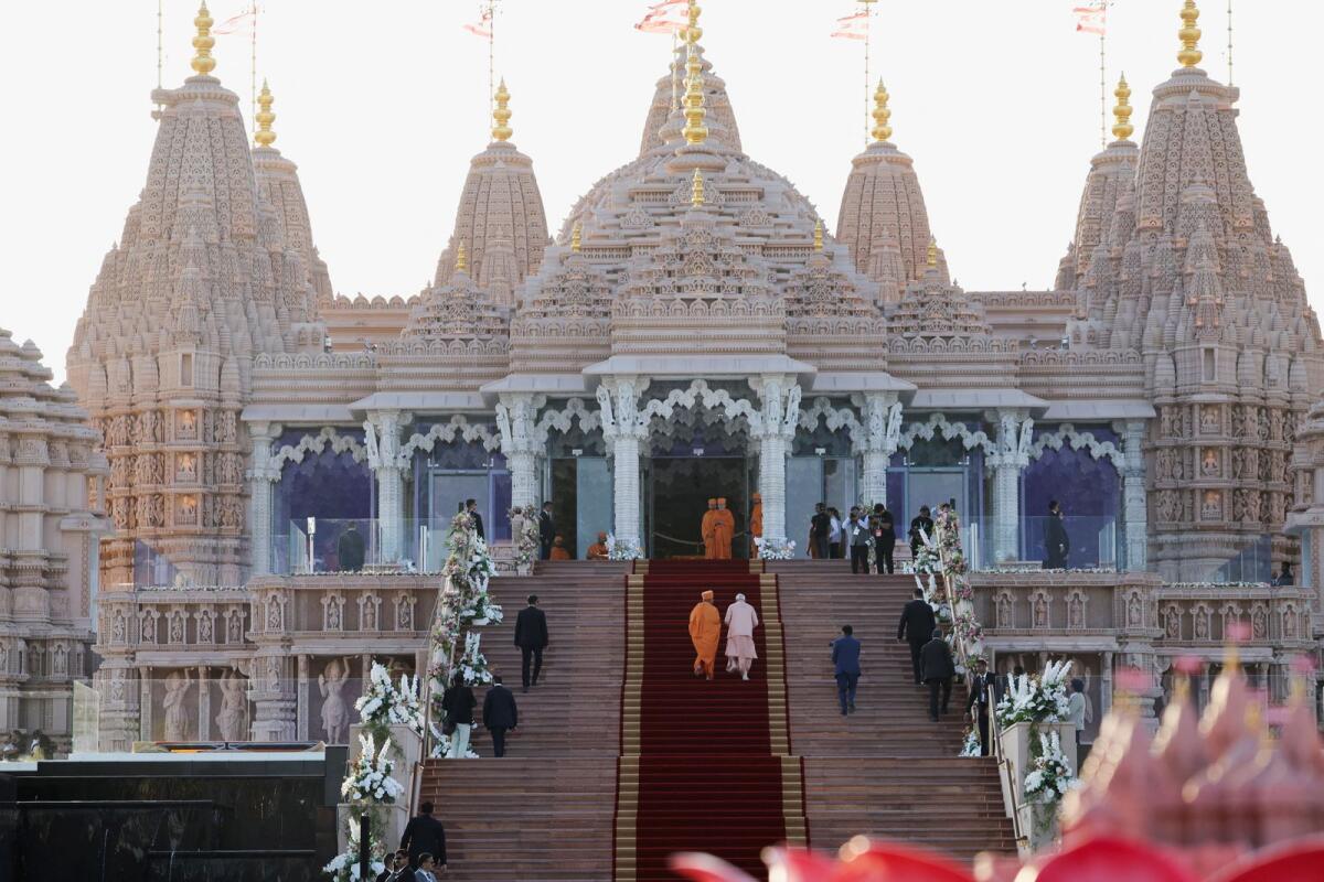 India's Prime Minister Narendra Modi climbs the stairs, as he attends the inauguration of the BAPS Hindu temple in Abu Dhabi, United Arab Emirates, February 14, 2024. Photo: Reuters