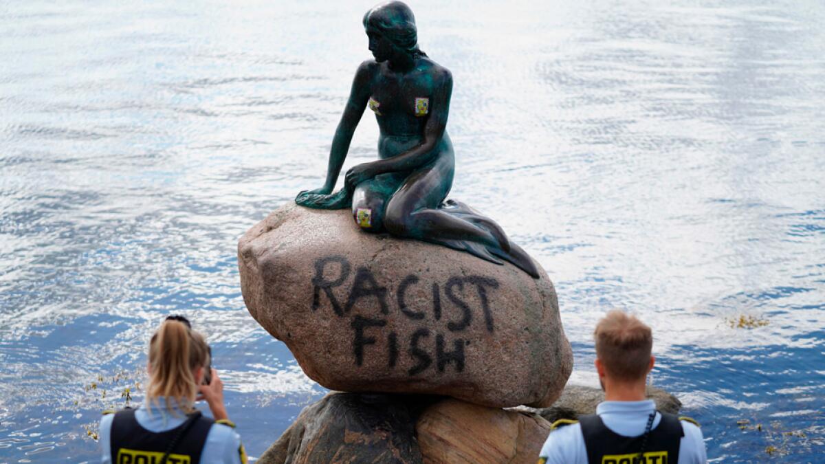 Police officers take pictures of the base of the Little Mermaid statue (Den lille Havfrue) after it was vandalised in Denmark. Photo: AFP&lt;br&gt;&lt;br&gt;(Research: Mohammad Thanweeruddin)
