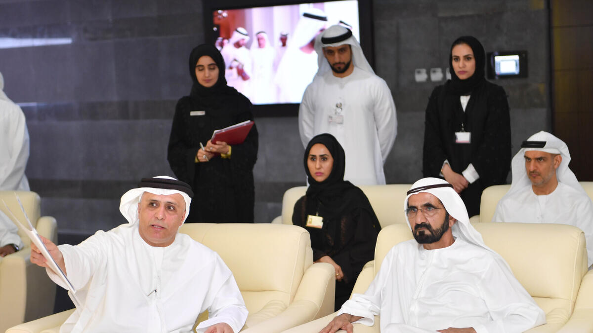 Shaikh Mohammed being briefed about the RTA's infrastructure projects by Mattar Al Tayer at the authority's headquarters in Umm Al Ramol on Saturday. - Wam