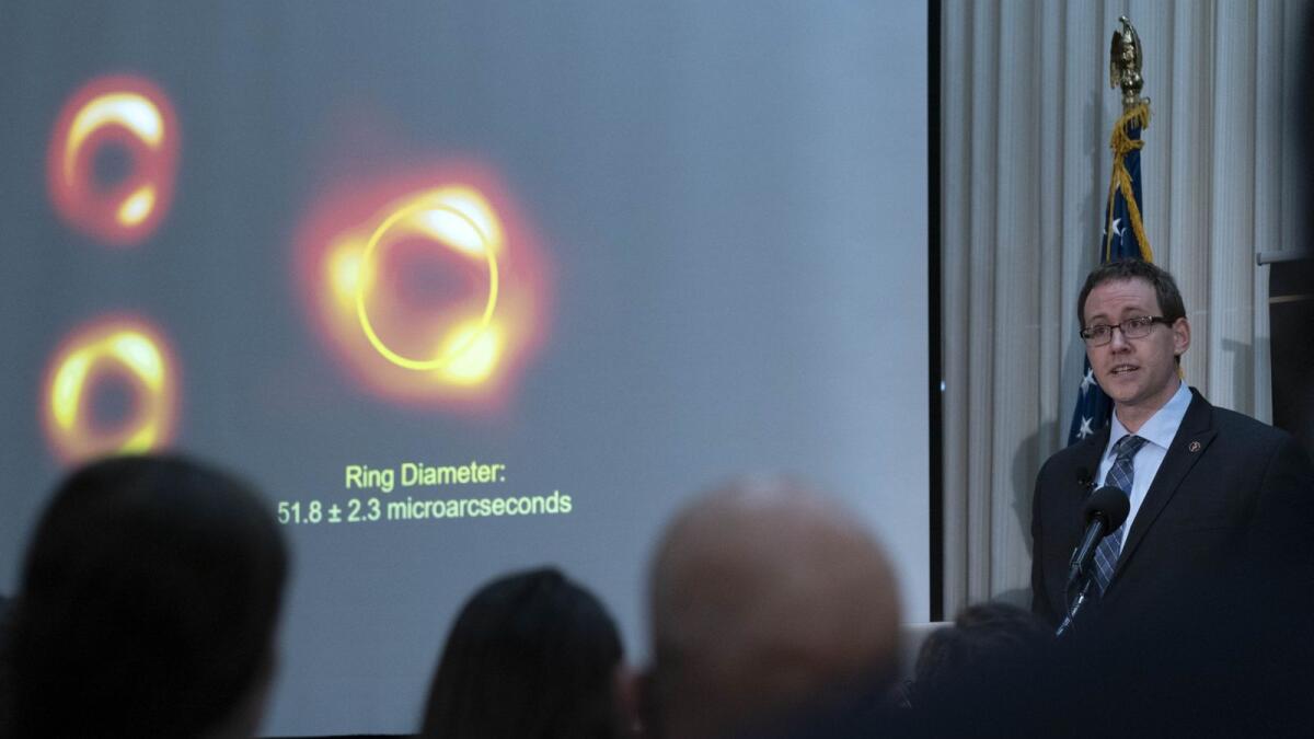 An astrophysicist speaks during a news conference to announce the first image of a black hole. – AFP