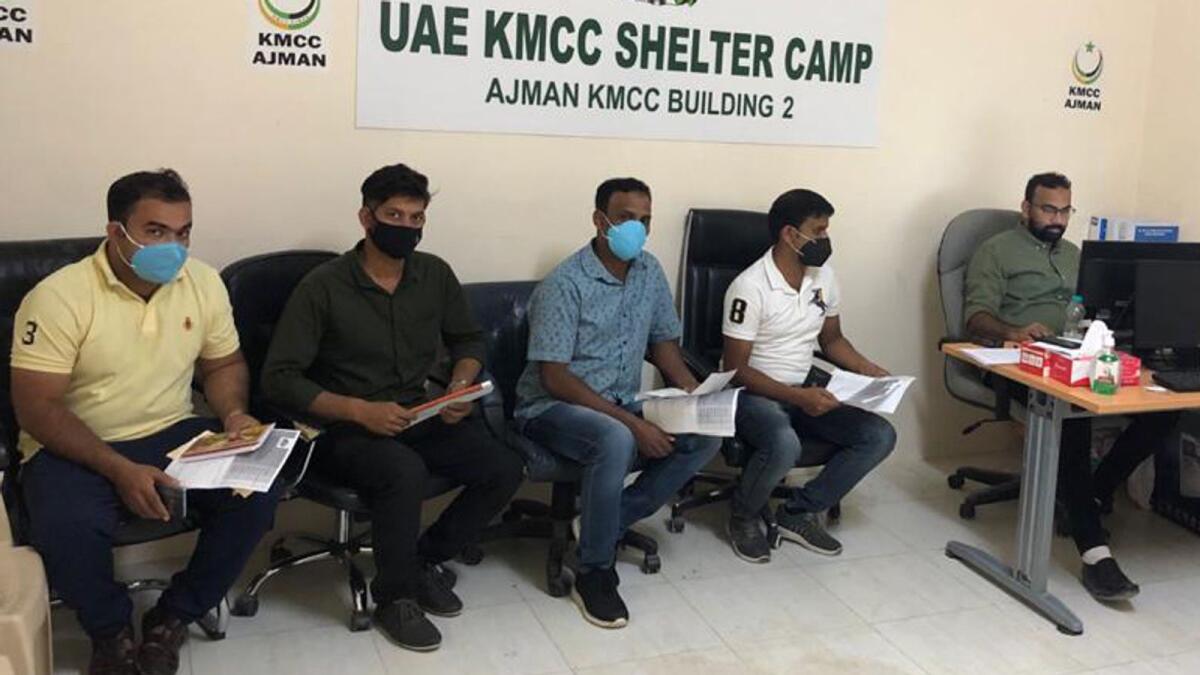 Stranded Indian expats during the registration process at a facility provided by Kerala Muslim Cultural Centre, UAE, in Ajman, on Monday. — Supplied photo
