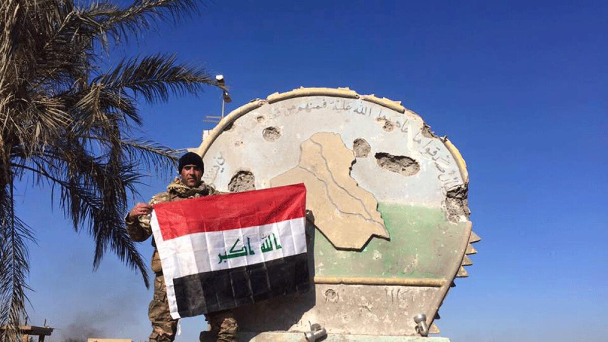 Iraq says forces raise flag above government complex in Ramadi