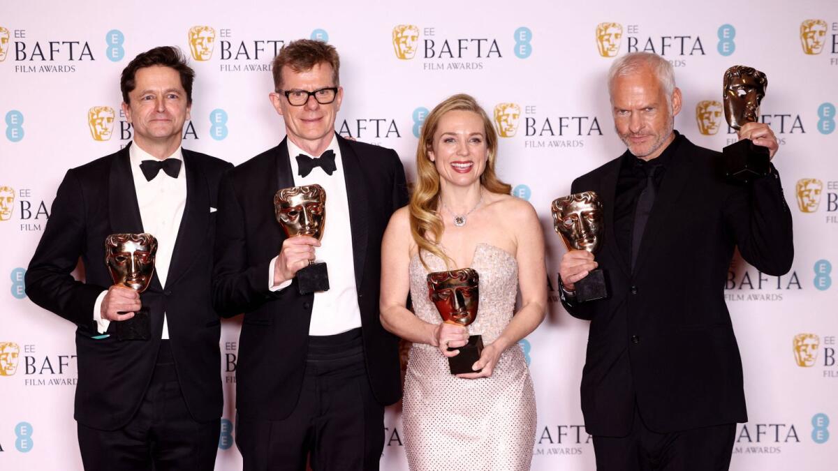 Graham Broadbent, Pete Czernin, and Martin Mcdonagh pose with their awards for Outstanding British Film for 'The Banshees Of Inisherin' alongside Kerry Condon posing with her Best Supporting Actress award