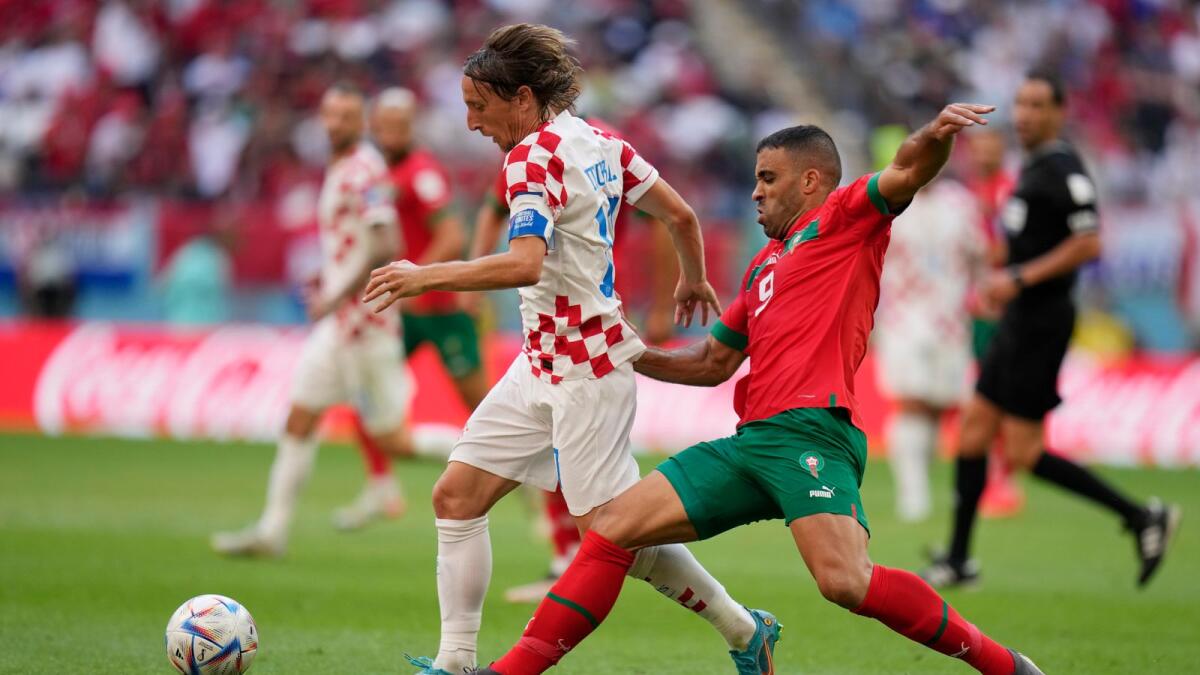 Croatia's Luka Modric and Morocco's Abderrazak Hamdallah challenge for the ball during the World Cup group match between Morocco and Croatia. — AP file