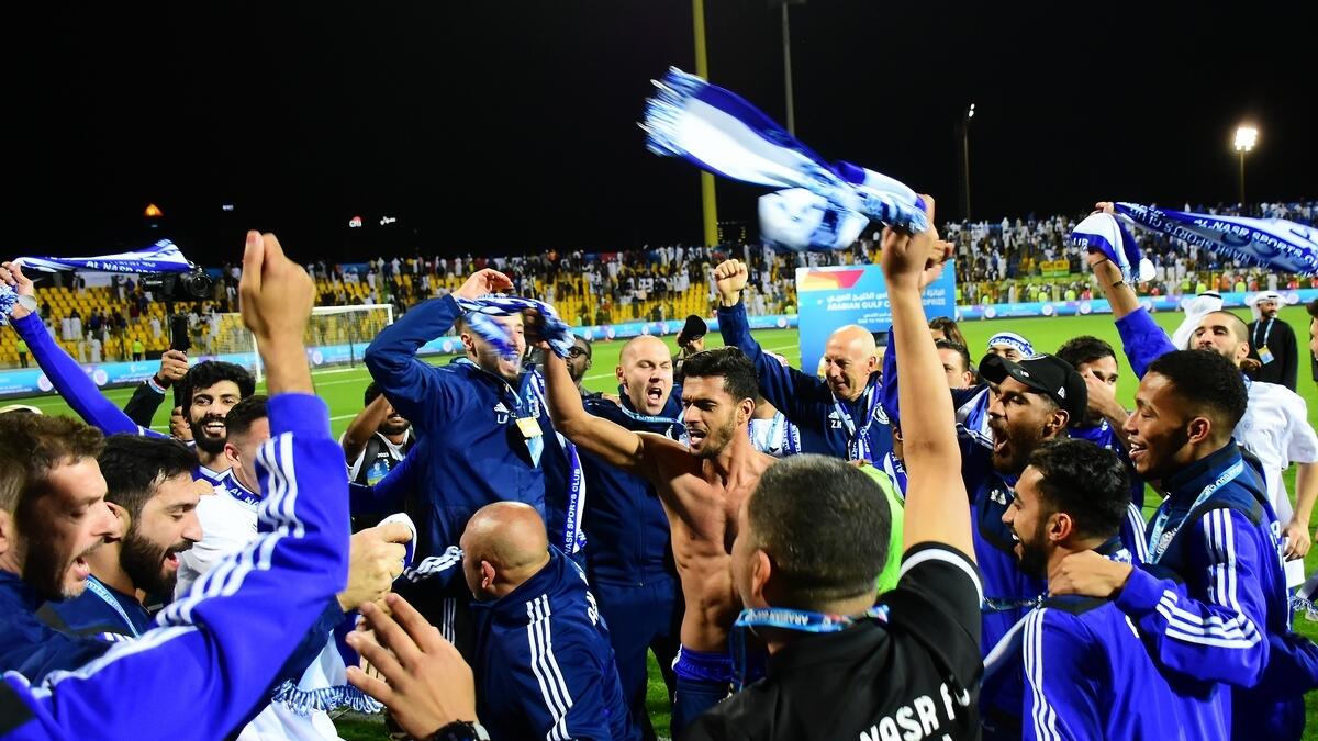 Team members of Al Nasr celebrate after they defeated the defending champions Shabab Al Ahli during the final.