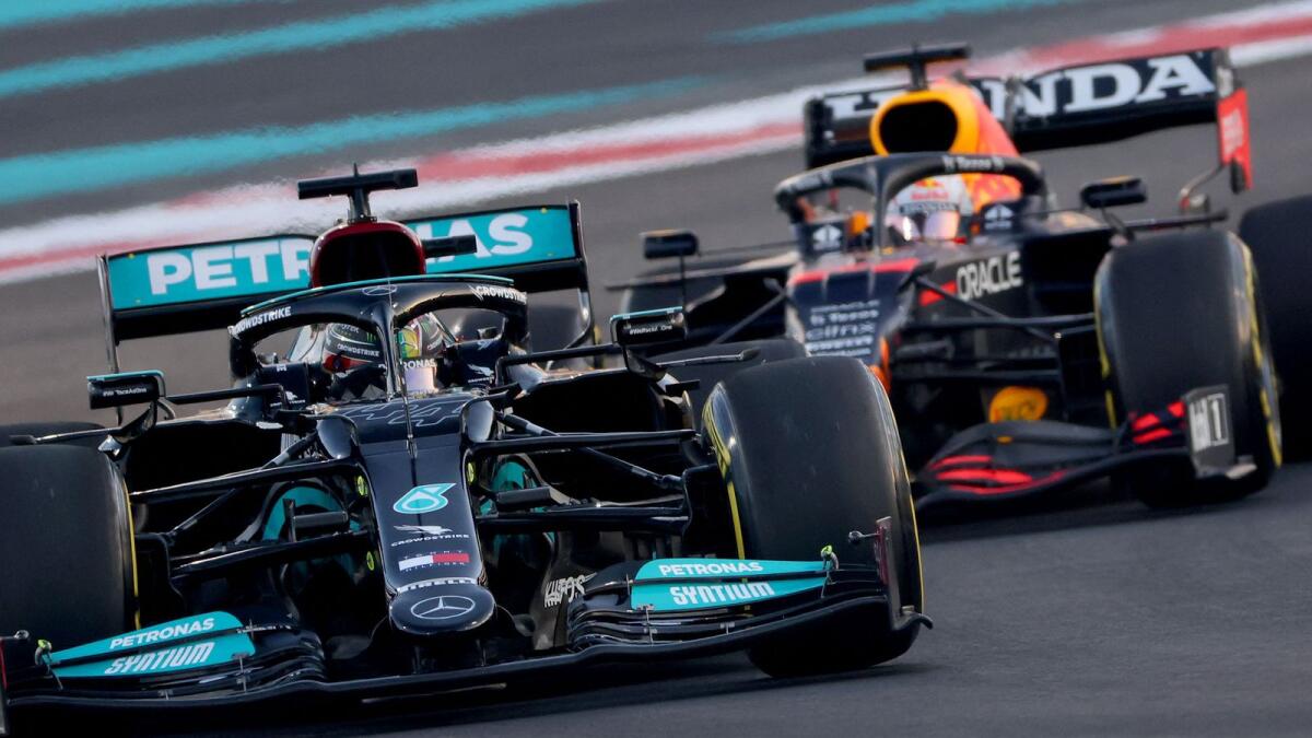 Mercedes driver Lewis Hamilton (left) and Red Bull driver Max Verstappen at the Yas Marina Circuit during the second free practice session of the Abu Dhabi Formula One Grand Prix. (AFP)