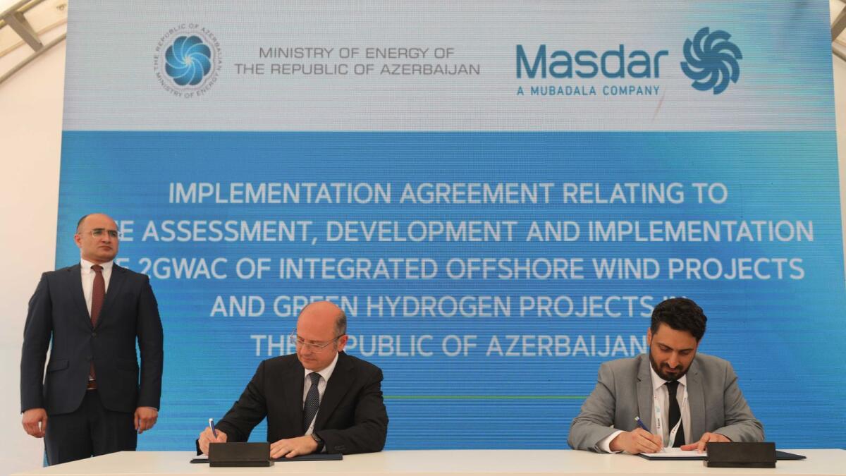 Parviz Shahbazov, Minister of Energy, and Fawaz Al Muharrami, acting executive director of Masdar Clean Energy, signing the agreements on behalf of Masdar, at an event in Shusha, held as a special session of Baku Energy Week. — Supplied photo