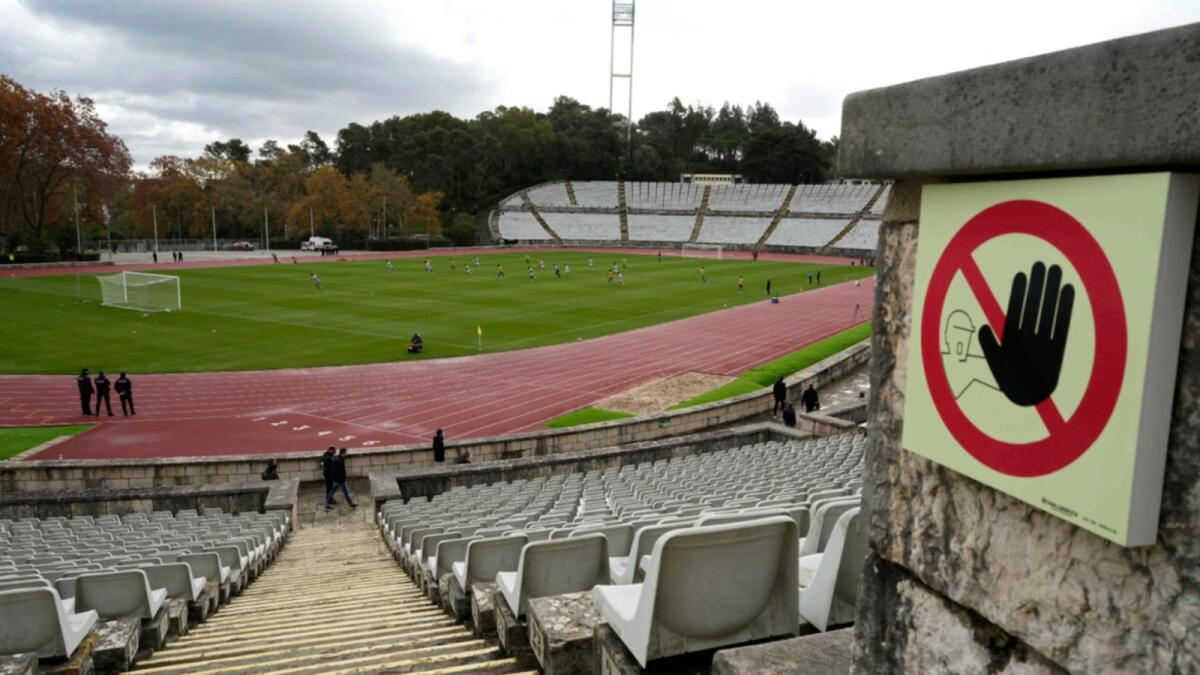 A soccer match in progress at the National stadium in Oeiras, home ground of the Lisbon-based Belenenses SAD club. — AP