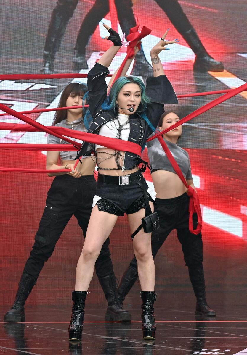 AleXa performing on a stage before a red carpet event for the film 'Top Gun: Maverick' in Seoul