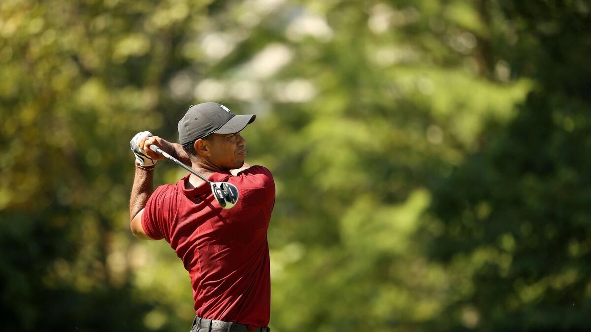 Tiger Woods of the United States plays his shot from the tenth tee