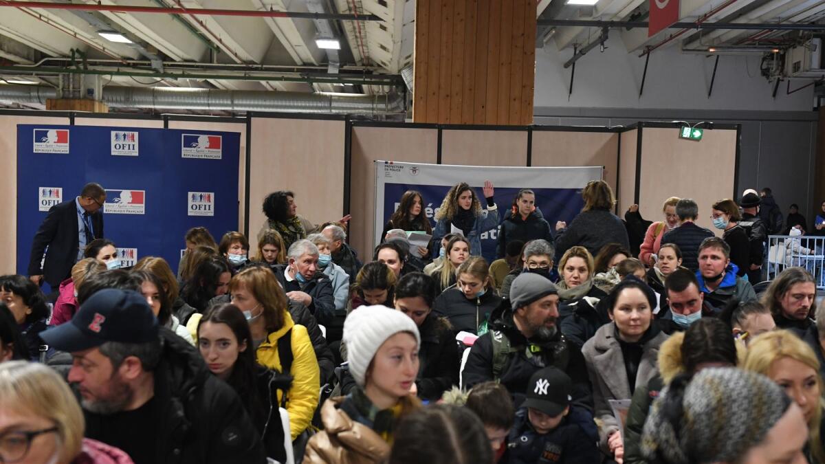 Ukrainians wait for registration by French immigration administration at a refugee welcome center in Paris on March 17, 2022 as the number of refugees fleeing Ukraine since Russia's incursion has grown by more than 100,000 over the past 24 hours, the United Nations says, calling the outflow of more than three million people a 'heartbreaking crisis'. Photo: AFP