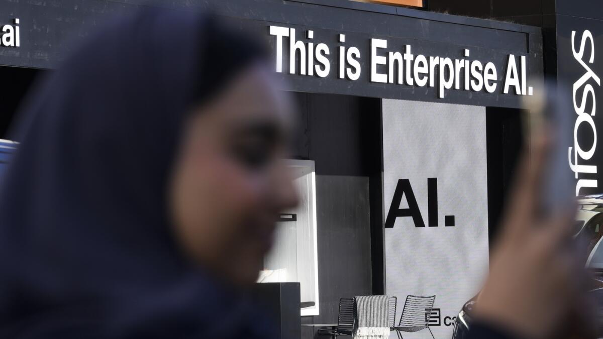 An advertisements pointing to the new AI technology displayed the Davos Promenade alongside the World Economic Forum in Davos. — AP