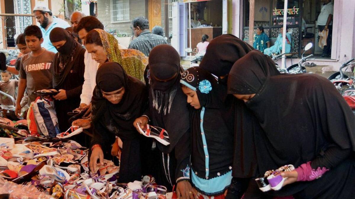Muslim women shop in a market ahead of the Eid-ul-Fitr festival in Karad, Maharashtra