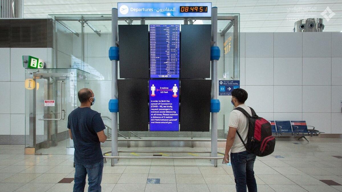 Posters and digital interfaces remind passengers about the need to maintain a 2-metre social distance and practise good hand hygiene.-@DXBMediaOffice/Twitter