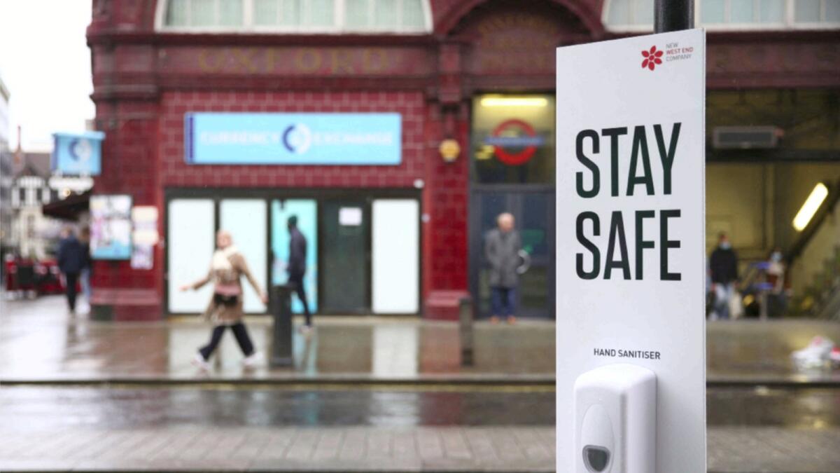 A hand sanitiser dispenser for combating the spread of the Covid-19 virus is pictured on Oxford Street in London. — AFP
