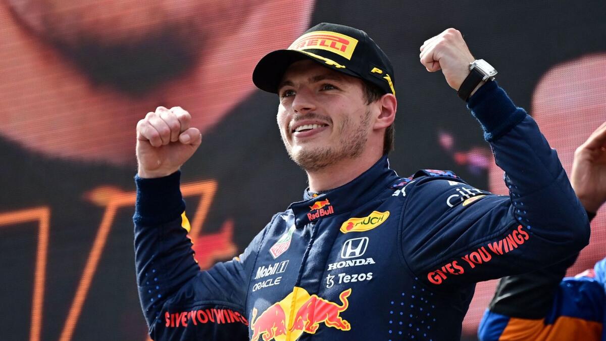 Red Bull's Dutch driver Max Verstappen celebrates on the podium after winning the Formula One Austrian Grand Prix. — AFP