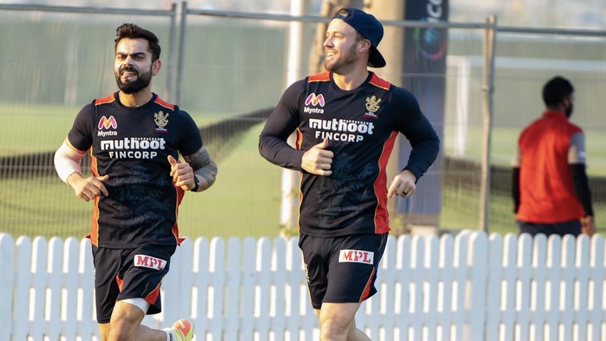 FOR A CAUSE: Royal Challengers Bangalore skipper Virat Kohli (left) and AB de Villiers during a training session in Dubai on Friday. - Royal Challengers Bangalore Twitter