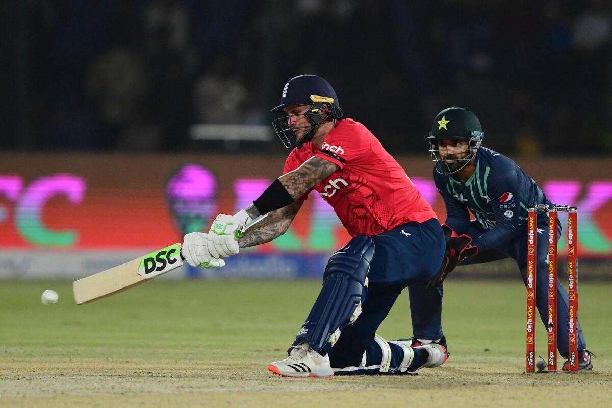 England's Alex Hales (left) plays a shot as Pakistan wicketkeeper Mohammad Rizwan looks on. (AFP)