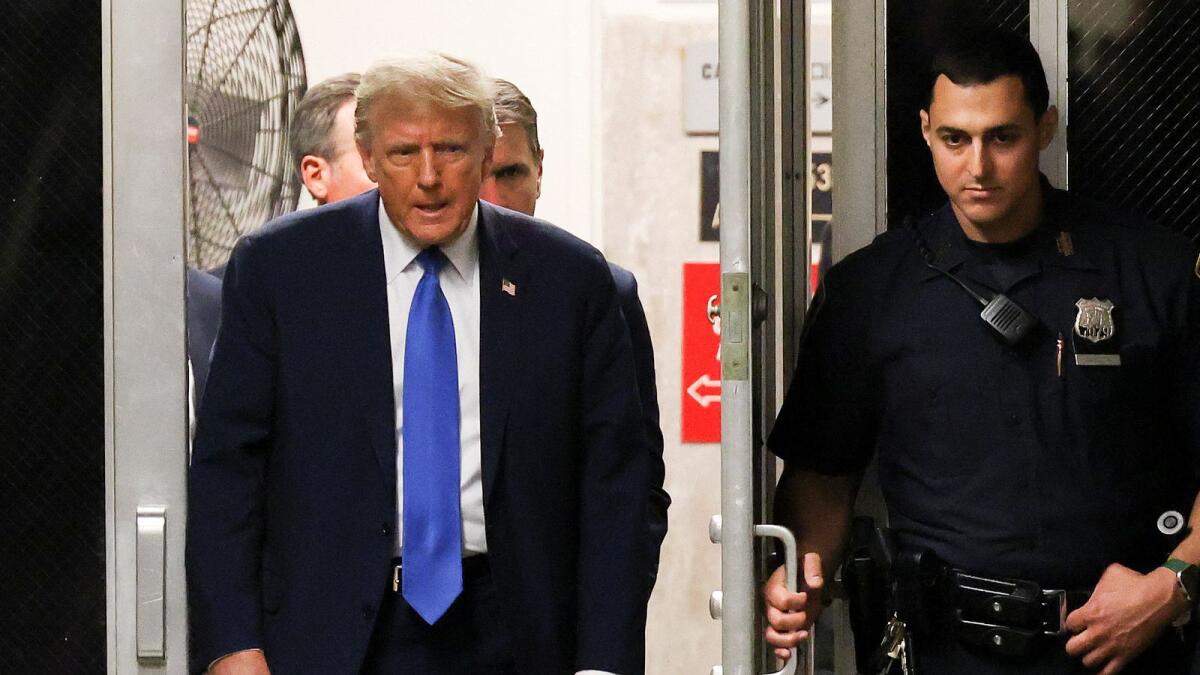Former US president Donald Trump returns to the courtroom after a recess during his trial for allegedly covering up hush money payments linked to extramarital affairs at Manhattan Criminal Court, in New York. — Reuters