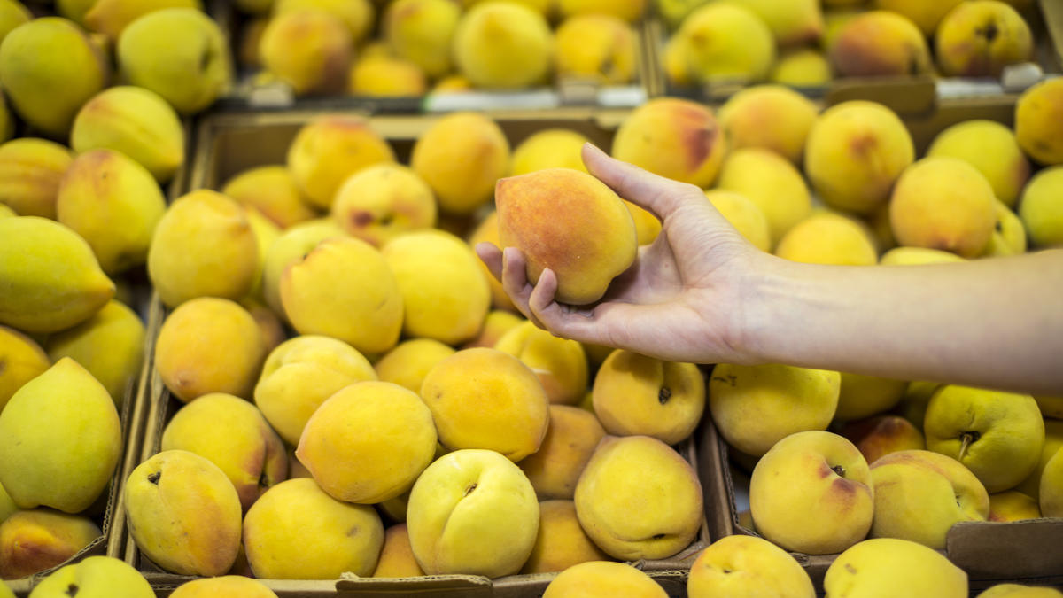 Italian woman, son held for stealing 460kg of peaches