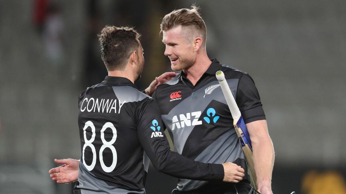 New Zealand's James Neesham (right) and Devon Conway celebrate their victory over the West Indies. (AFP)