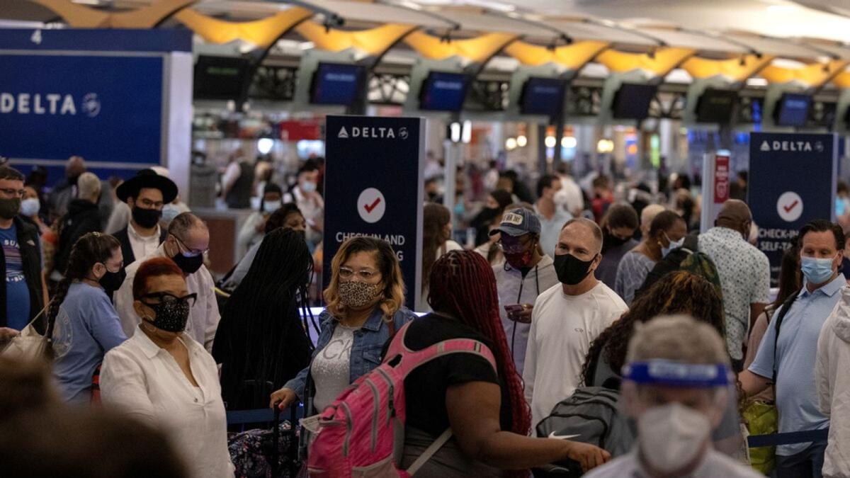 Passengers gather near Delta airline's counter as they check-in their luggage at Hartsfield-Jackson Atlanta International Airport. — Reuters