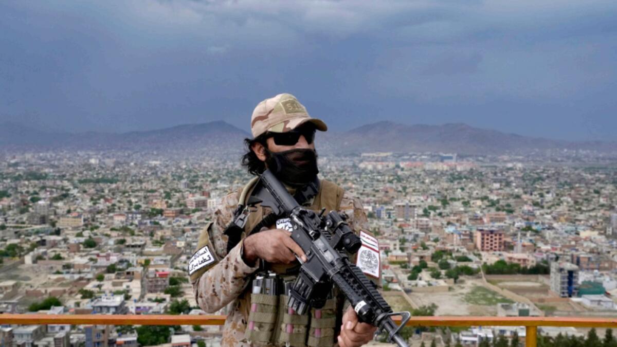 A Taliban special forces soldier stands guard at a park. — AP