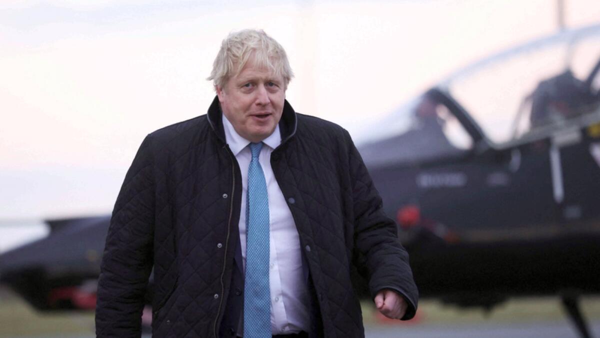 Britain's Prime Minister Boris Johnson looks on, during a visit to RAF Valley, in Anglesey, North Wales. — AP
