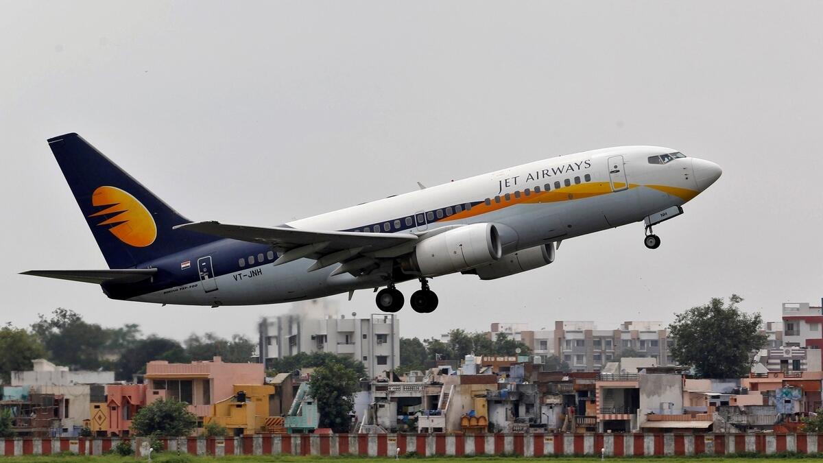 A Jet Airways passenger aircraft takes off from the airport.- Reuters