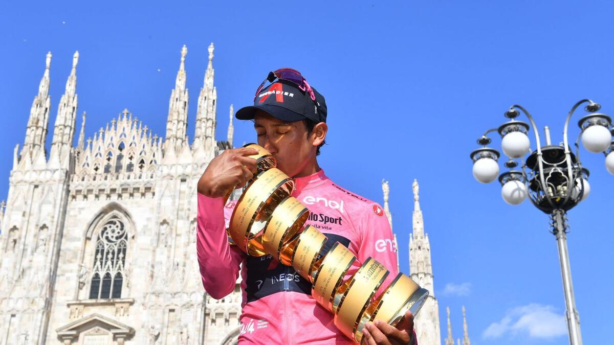 Ineos Grenadiers rider Egan Arley Bernal Gomez of Colombia poses with the trophy as he celebrates winning the Giro d'Italia in front of the Duomo di Milano. — Reuters