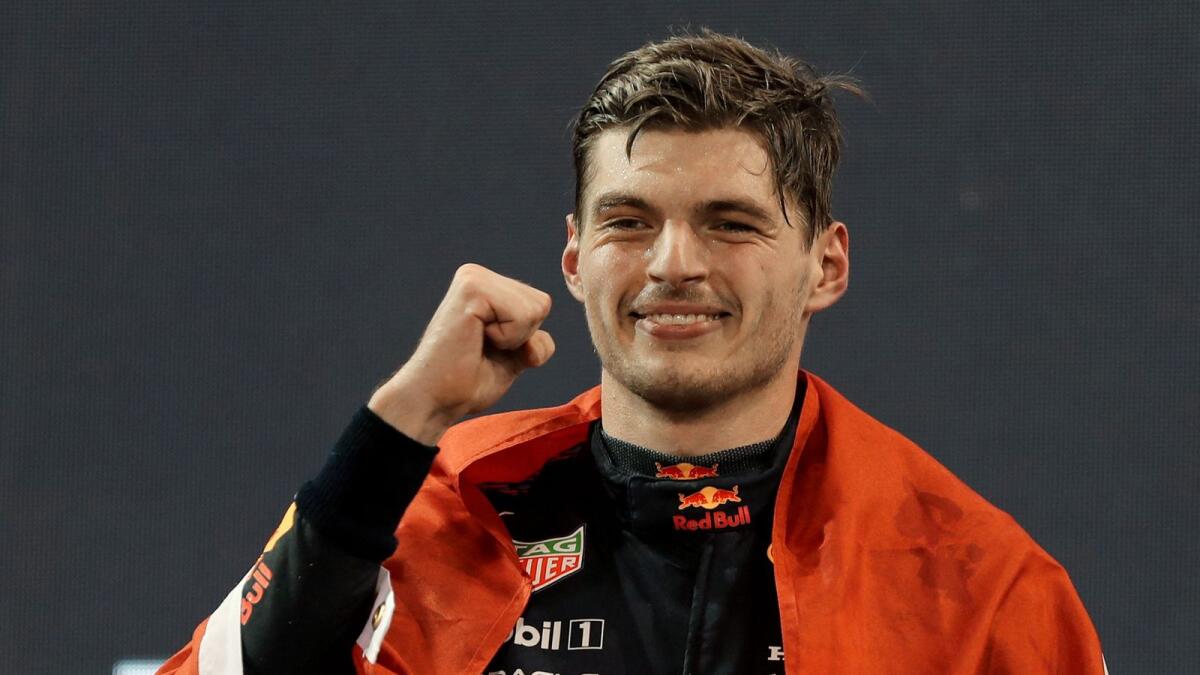 Red Bull's Dutch driver Max Verstappen celebrates on the podium after the Abu Dhabi Formula One Grand Prix. (AFP)