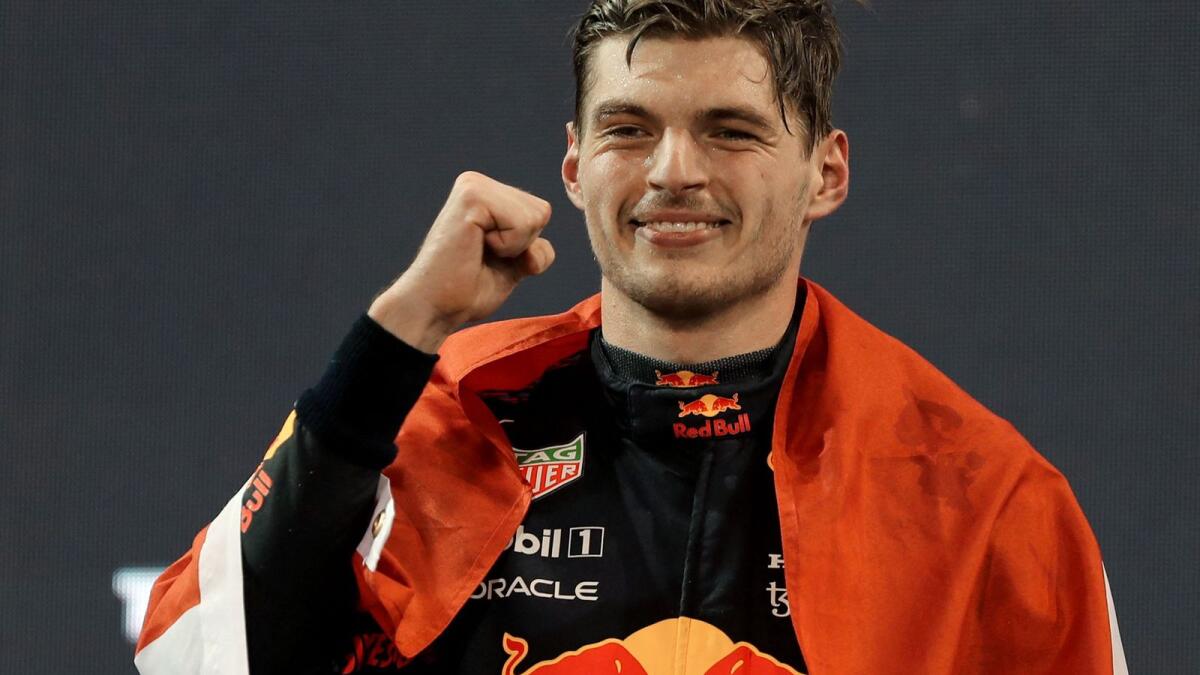 Red Bull's Dutch driver Max Verstappen celebrates on the podium after the Abu Dhabi Formula One Grand Prix. (AFP)