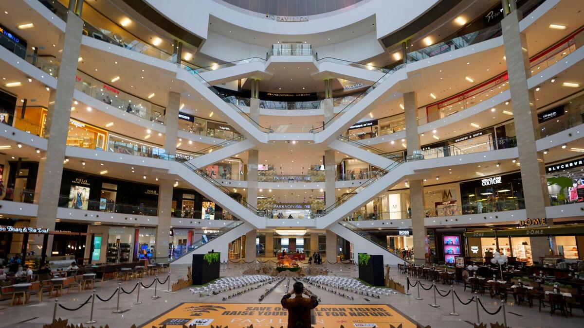 A shopper takes a picture of shopping mall in Kuala Lumpur, Malaysia. Asean’s focus on becoming future-ready in areas such as digital and renewable energy offers Middle East companies and investment firms’ ample opportunities to invest, develop and provide solutions to meet their sustainability goals. — AP file photo