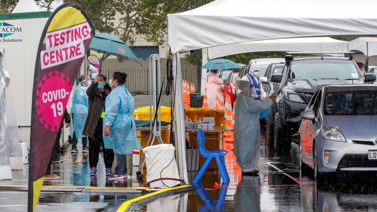 Motorists queue a testing station as the daily infections in New Zealand rise. Photo: AFP