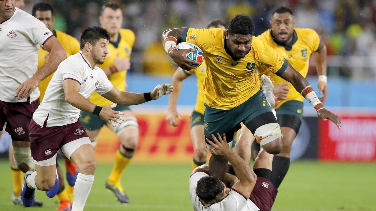 Australia outlast Georgia to stumble into knockout stages