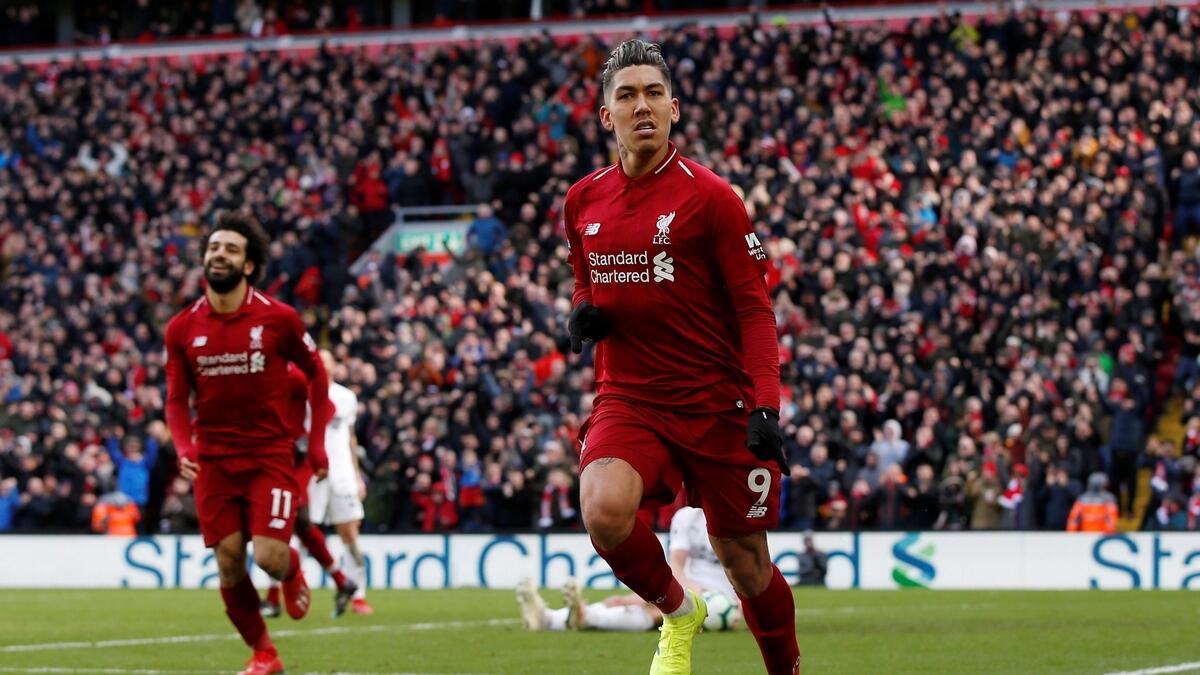Firmino, Mane keep Liverpool in touch with Man City