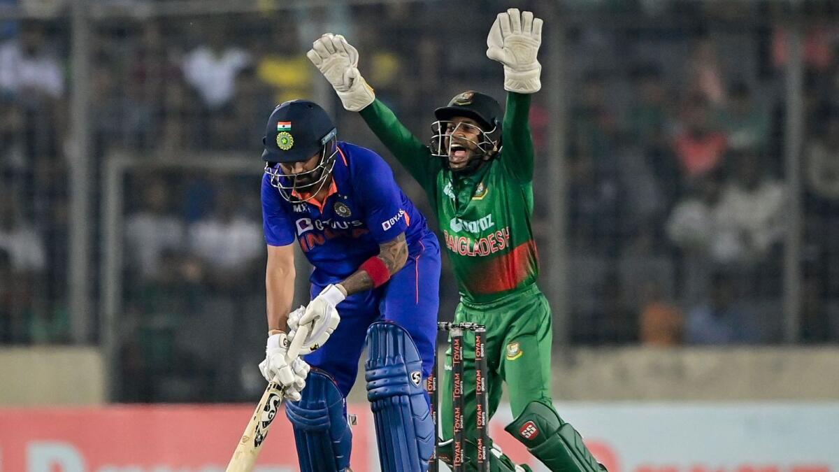 Bangladesh's wicketkeeper Mushfiqur Rahim (Rright) celebrates after the dismissal of India's KL Rahul during the second One-Day International on Wednesday. — AFP