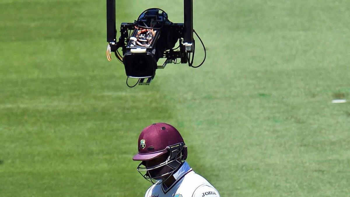 West Indies batsman Marlon Samuels is followed by the “spidercam” after being dismissed by Australia on the fourth day of the second Test in Melbourne on December 29, 2015. 