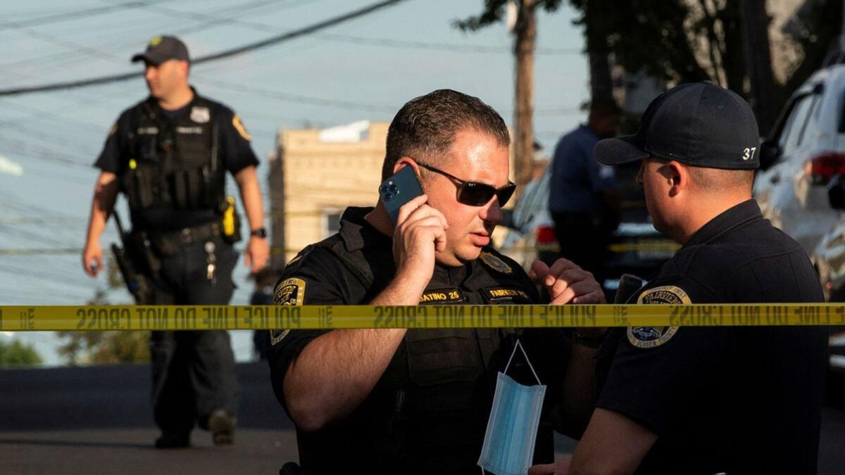 Police officers stand guard near the building where alleged attacker of Salman Rushdie, lives in New Jersey. – Reuters