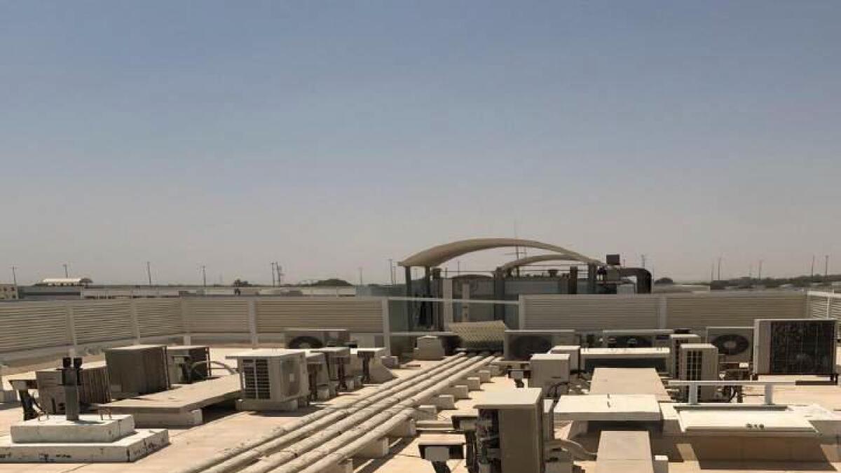 Abu Dhabi, building owners, booked, warned, untidy rooftops,
