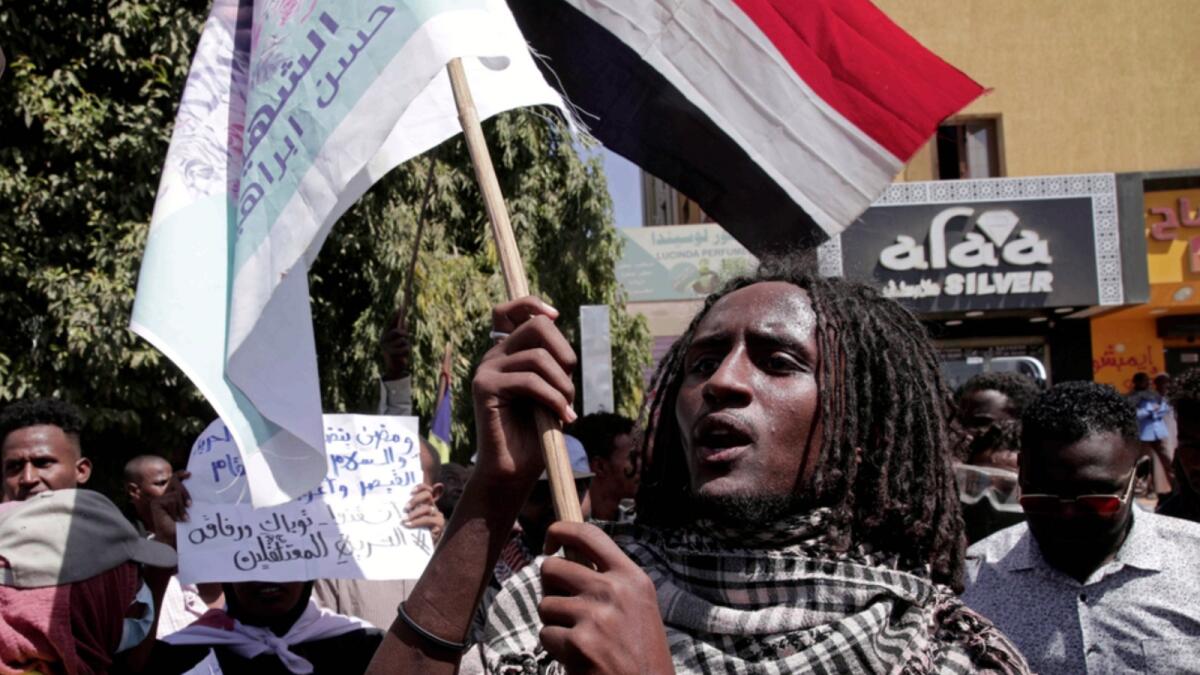 People protest against last year's military coup, in Khartoum. — AP