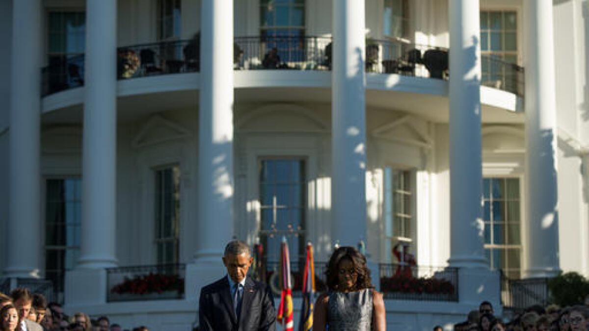 Obama observes 9/11 moment of silence in Oval Office
