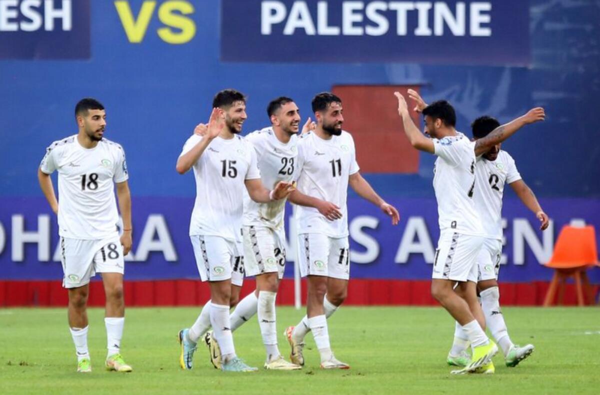 Palestine players celebrate their victory on Tuesday. — AFC