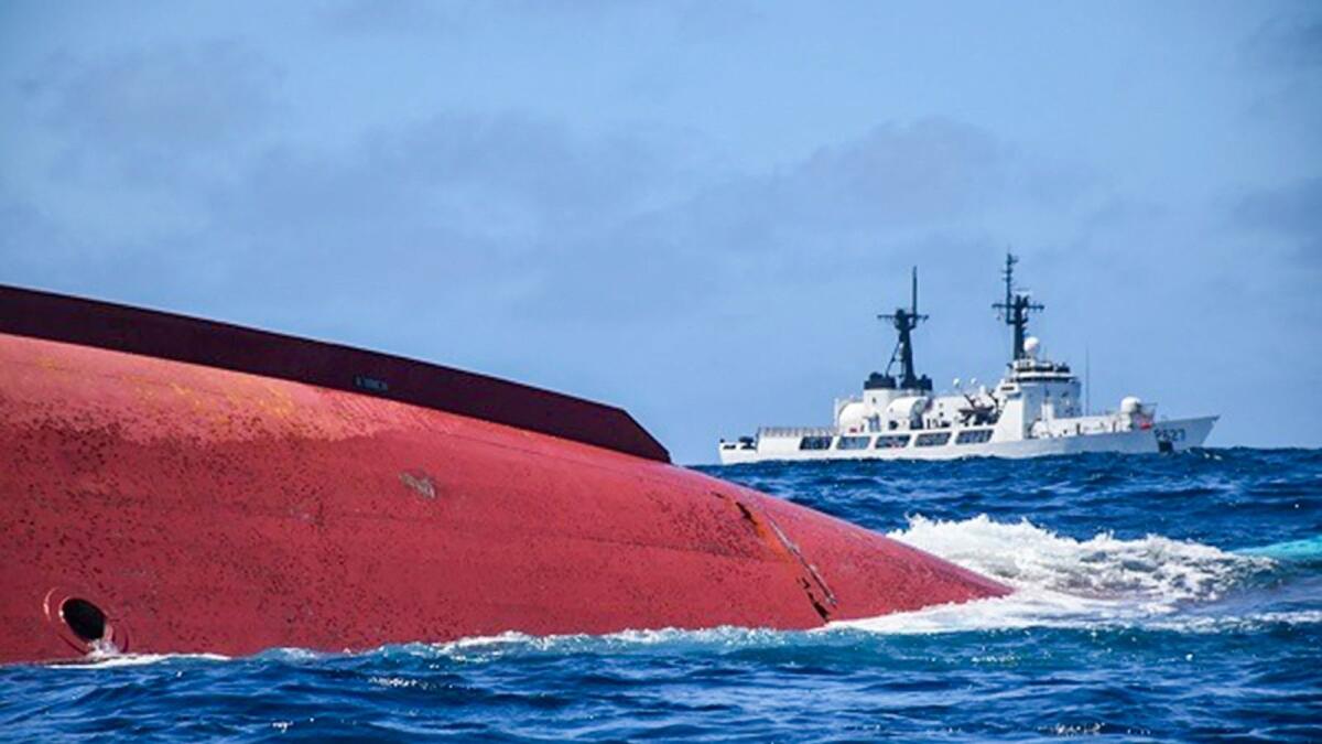 A capsized Chinese fishing vessel (Lu Peng Yuan Yu 028) in the Indian Ocean.  — AFP