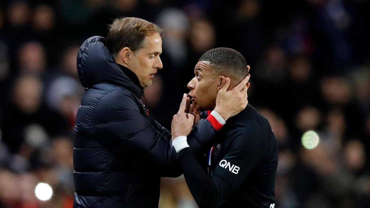 PSG's Kylian Mbappe (right) talks with Thomas Tuchel during a League One match. (AP)