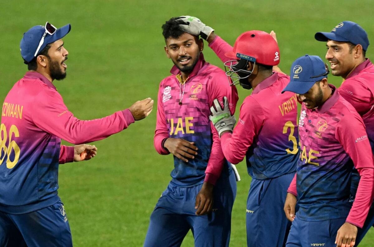 Karthik Meiyappan (centre) took a stunning hat trick against Sri Lanka in the ICC T20 World Cup. — UAE Cricket Twitter