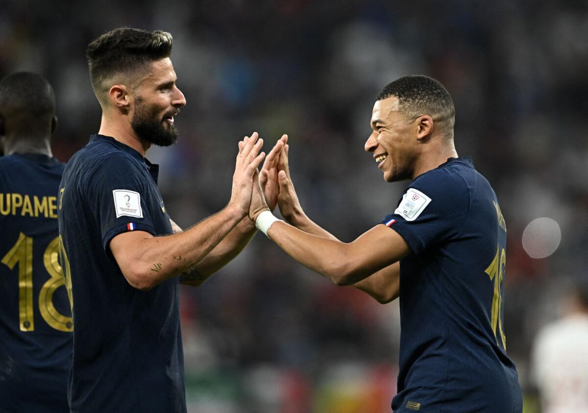 France's Kylian Mbappe celebrates scoring their second goal with Olivier Giroud. Photo: Reuters