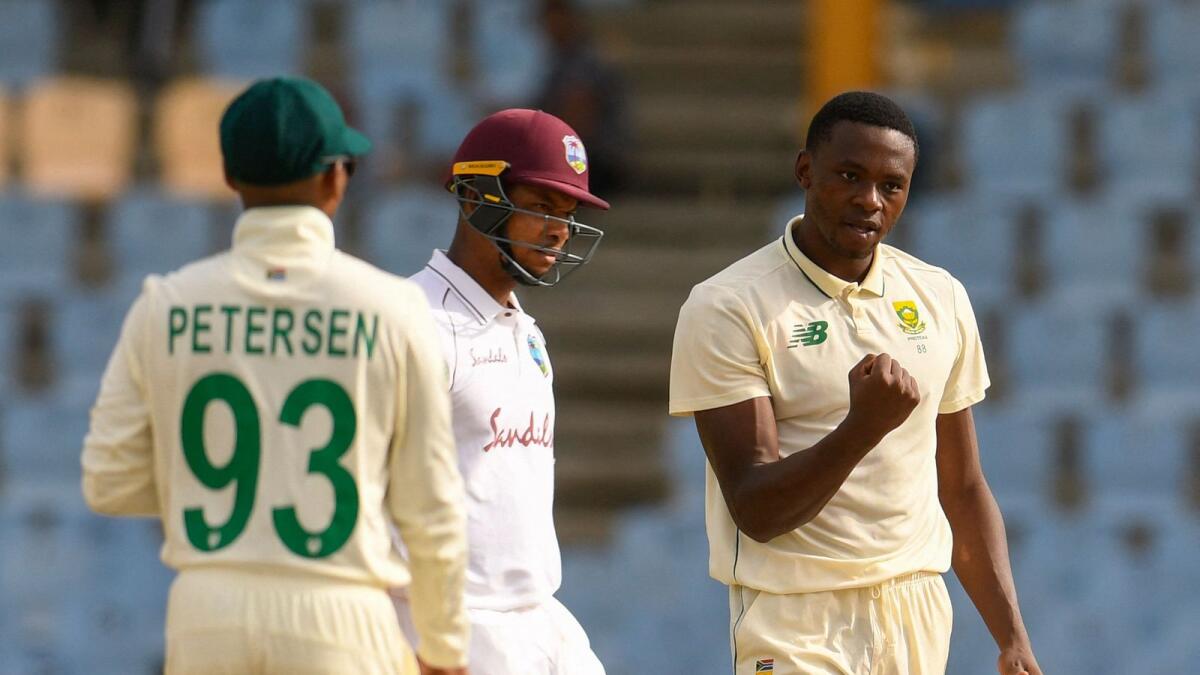 Kagiso Rabada (right) of South Africa celebrates the dismissal of Kieran Powell (centre) of West Indies. (AFP)