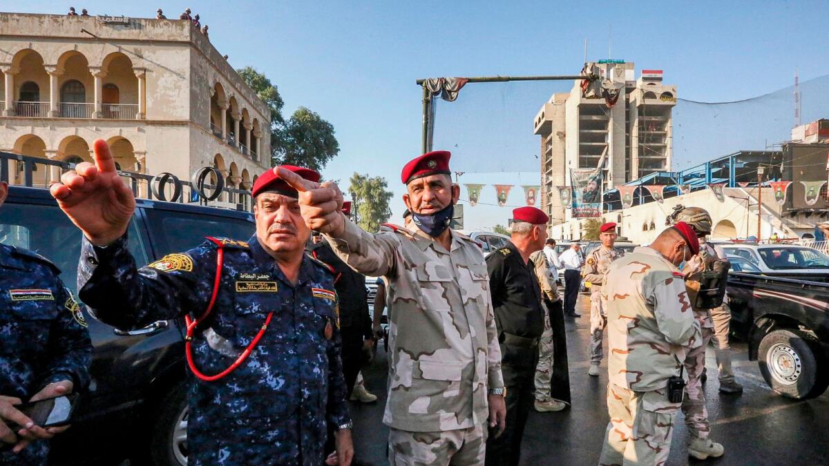 Lieutenant General Qais Al Muhammadawi (C), Baghdad Operations Commander, oversees the reopening of the Jumhuriya bridge across the Tigris River, leading from Baghdad's central Tahrir Square to the Green Zone, on Saturday.