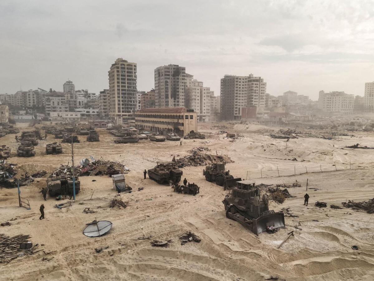 Israeli military vehicles operate during ground operation of the Israeli army against Hamas, at a location given as Gaza. Photo: Reuters
